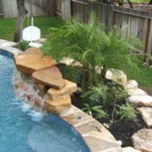small amount of greenery next to a pool